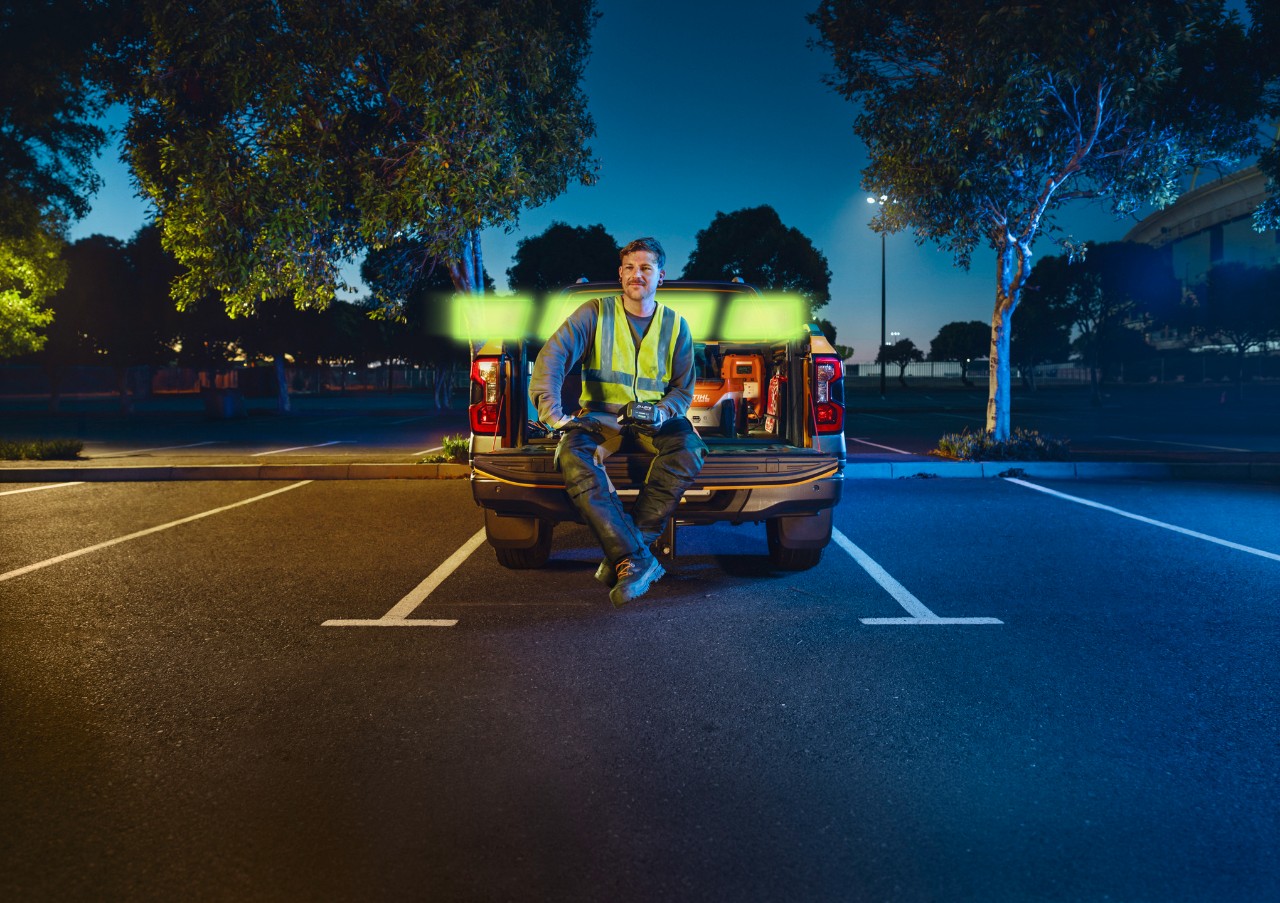 The ALLPRO STIHL AP 300.0 P C in the hands of a professional sitting on the bed of a truck.